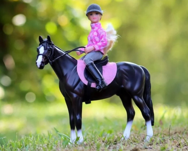 Breyer model #1630 and features a pretty black Saddlebred with English tack and rider